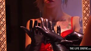 Blindfolded in gloves and corset, she fingers her wet pussy without panties.