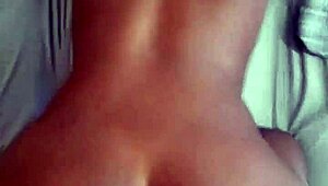 Mistress oils up her slaves for bed play