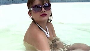 girl relaxes in jacuzzi while pleasuring herself