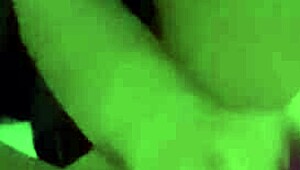 Amateur woman demonstrates toy use in homemade setting