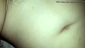 The white girl wearing a red hat and yellow outfit is observed by a voyeur