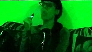 Hungarian goth mistress smokes in green light setting