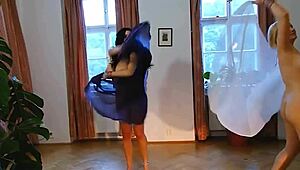 two plump belly dancers slowly undress on stage