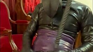 Wearing a tight gas mask for intense latex-rubber fetish play