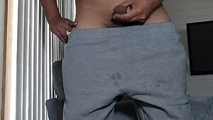 Chalatan strokes his cock in the living room.