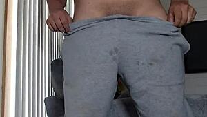 Chalatan strokes his cock in the living room.