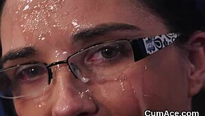 Nasty doll receives cumshot on face while eating jism