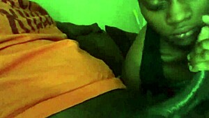 Nineteen-year-old black teen sucks and swallows big black cock eagerly.