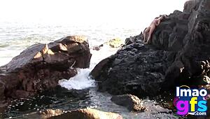 Hot brunette babe in lingerie on beach