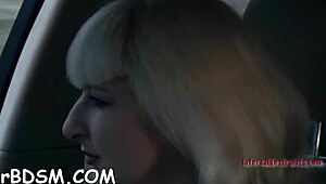 Caged brunette slave gives blowjob with toys