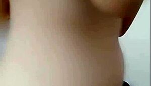 Pretty girl performs live webcam show with engaging interactions.