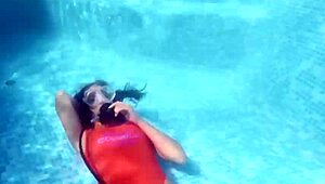 amelie bruna masturbates underwater in the pool, her nude body glistening