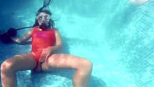 amelie bruna masturbates underwater in the pool, her nude body glistening