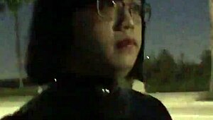 cd in latex walks outdoors with vibrator attached