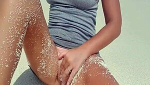 Sexy Blonde Masturbates by the Sea with Hot Ass Covered in Sand