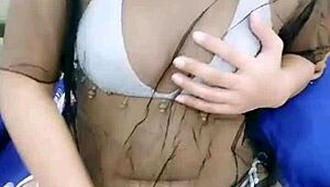 asian stripper teasing with clothes ripped during striptease