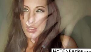 Kortney Kane lounges nude on the white sofa, showcasing big tits, pussy, and ass.