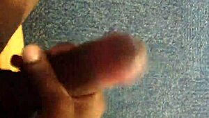 Watch this black guy rubbing his monster cock.