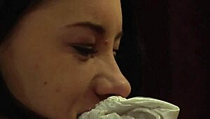 Tied up bent over lesbian slave endures whipping and humiliation from femdom