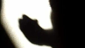 she masturbates in the shadows, playing with herself