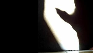 she masturbates in the shadows, playing with herself