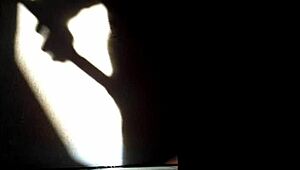 she masturbates in the shadows, playing with herself