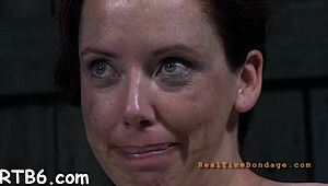 Tied up beauty gets toy gratification deep in her wet vagina. She squirms hard.