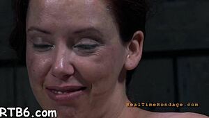 Tied up beauty gets toy gratification deep in her wet vagina. She squirms hard.