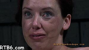 Tied up beauty gets toy gratification deep in her wet vagina. She squirms hard.