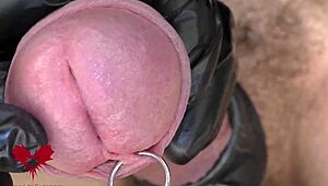 Watch this close-up of latex gloves teasing the peehole before a horny cumshot explodes.