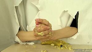 Japanese handjob crushes messy banana in fetish food play