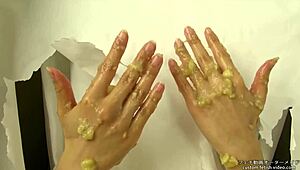 Japanese handjob crushes messy banana in fetish food play
