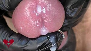 Watch this close-up of latex gloves teasing the peehole before a horny cumshot explodes.