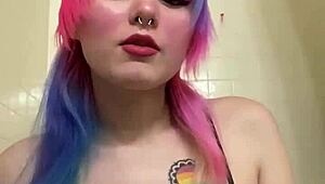 alice bangz is in the bathroom, cleaning up as a maid with her tattoo showing