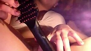 Watch this horny latina teen masturbate with a comb