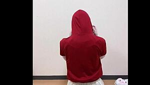 A girl in a short skirt slowly masturbates, touching herself under the fabric while fantasizing about being watched.