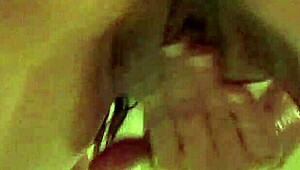 Hot oily brunette rides huge dildo in bathtub lingerie