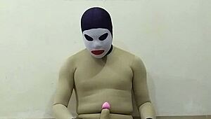 slave in zentai gets femdom cbt on penis