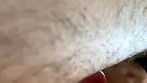 Rear view of gay deepthroat gagging and choking on hairy cock.