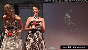 Female and male strippers tease crowd with erotic dance moves