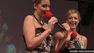 Female and male strippers tease crowd with erotic dance moves