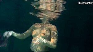 Lozhkova lounges in see-through shorts by the pool