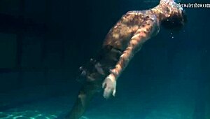 Lozhkova lounges in see-through shorts by the pool