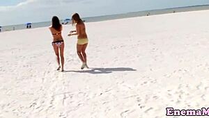 Babes feel intense pleasure in bizarre enema fetish, rimming each other in the shower