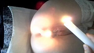 extreme bdsm with candles in pussy and ass for submissive punishment