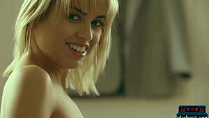 Perfect blonde babe Margo Dumas shows off her big round ass in a striptease