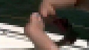 Lesbian femdom in stockings licks silky thighs in bdsm fetish scene