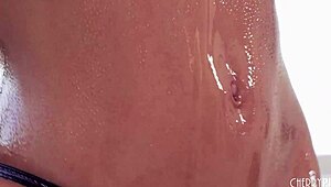 In the scene, oiled petite asian mina luxx engages in a standing 69 before a slippery hardcore fuck