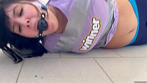ball gagged girl struggles hard in barefoot tape bondage challenge