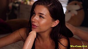 Girl on webcam masturbates bent over in doggy style.